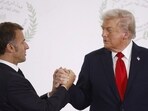 Trump's stern words to Emmanuel Macron during tense handshake at Egypt summit revealed by lip reader (Yoan Valat/Pool via REUTERS)