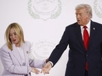 Italian Prime Minister Giorgia Meloni leaves after posing for a photo with US President Donald Trump, at a world leaders' summit on ending the Gaza war.