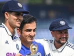India skipper Shubman Gill, coach Gautam Gambhir and spinner Kuldeep Yadav pose with the trophy after their 2-0 Test series win over West Indies in Delhi on Tuesday. (Sanchit Khanna/HT Photo)