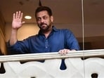 Salman Khan waving at fans from his Galaxy apartment.
