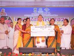 Chief Minister Pushkar Singh Dhami and Cooperation Minister Dr Dhan Singh Rawat presenting cheques to women’s self-help groups during the Cooperative Fair in Srinagar, Pauri Garhwal. Chief Minister Pushkar Singh Dhami and Cooperation Minister Dr Dhan Singh Rawat presenting cheques to women’s self-help groups during the Cooperative Fair in Srinagar, Pauri Garhwal.