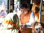 Chief Minister Pushkar Singh Dhami interacts with a pilgrim before flagging off a group of senior citizens for the Gangotri Dham pilgrimage under the state’s Matri-Pitri Teerthatan Yojana, in Haldwani on Tuesday. Chief Minister Pushkar Singh Dhami interacts with a pilgrim before flagging off a group of senior citizens for the Gangotri Dham pilgrimage under the state’s Matri-Pitri Teerthatan Yojana, in Haldwani on Tuesday.