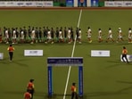 India hockey players doing high fives with Pakistan in Sultan of Johor Cup