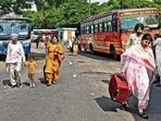 Stranded commuters scrambling to find alternative transport at the bus stand in Ludhiana on Tuesday. (HT Photo)