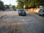 The dilapidated condition of the main road leading to Sector 56. (Parveen Kumar/HT Photo)