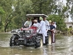 Union agriculture minister Shivraj Chouhan with minister of state for railways Ravneet Singh Bittu, BJP national general secretary Tarun Chugh and Punjab BJP chief Sunil Jakhar riding a tractor in flood-affected Ramdass in Amritsar district on September 4. (File photo)