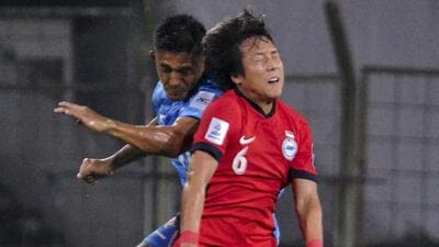 Goa: Players of India (in blue) and Singapore vie for the ball during their 2027 AFC Asian Cup qualifier football match, in Goa, Tuesday. (PTI) Goa: Players of India (in blue) and Singapore vie for the ball during their 2027 AFC Asian Cup qualifier football match, in Goa, Tuesday. (PTI)