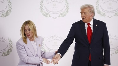 Italian Prime Minister Giorgia Meloni leaves after posing for a photo with US President Donald Trump, at a world leaders' summit on ending the Gaza war. (via REUTERS)