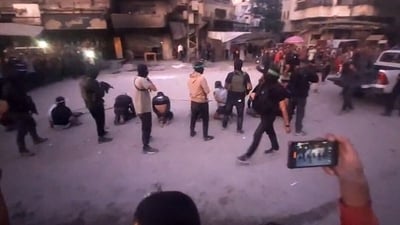 This image grab from a handout video released by the Hamas-run al-Aqsa TV's Telegram channel on October 13, 2025. (AFP)