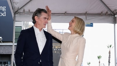 Billy Crudup and his wife actor Naomi Watts pose next to her newly unveiled star. (REUTERS)