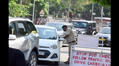 Panjab University security personnel checking the vehicles for stickers at an entry gate on Tuesday. (Ravi Kumar/HT) Panjab University security personnel checking the vehicles for stickers at an entry gate on Tuesday. (Ravi Kumar/HT)