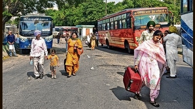 Stranded commuters scrambling to find alternative transport at the bus stand in Ludhiana on Tuesday. (HT Photo) Stranded commuters scrambling to find alternative transport at the bus stand in Ludhiana on Tuesday. (HT Photo)