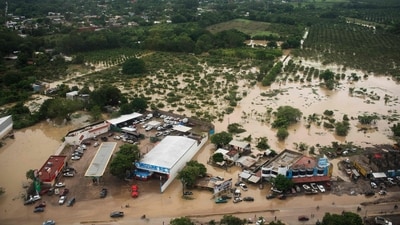Aerial view taken during a Mexican Navy flyover shows the flooded streets after heavy rains in Poza Rica, Veracruz state, Mexico. (AFP) Aerial view taken during a Mexican Navy flyover shows the flooded streets after heavy rains in Poza Rica, Veracruz state, Mexico. (AFP)