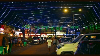 The Sector 22 market illuminated with colourful lights to welcome shoppers during the festive season. (Keshav Singh/HT) The Sector 22 market illuminated with colourful lights to welcome shoppers during the festive season. (Keshav Singh/HT)