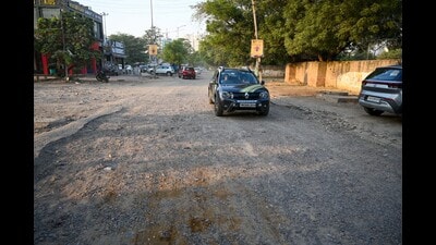 The dilapidated condition of the main road leading to Sector 56. (Parveen Kumar/HT Photo) The dilapidated condition of the main road leading to Sector 56. (Parveen Kumar/HT Photo)