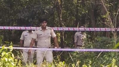 West Bengal police personnel during a reconstruction of the crime scene as part of the ongoing probe into the medical student’s rape case in Durgapur on Tuesday. (PTI) West Bengal police personnel during a reconstruction of the crime scene as part of the ongoing probe into the medical student’s rape case in Durgapur on Tuesday. (PTI)