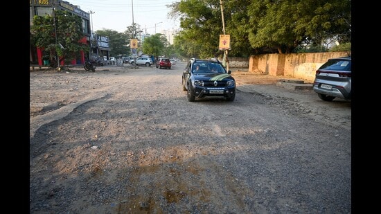 The dilapidated condition of the main road leading to Sector 56. (Parveen Kumar/HT Photo)
