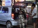 CISF jawans checking two and four wheelers vehicles ahead of Bihar Assembly Election 2025 at Dak Bungalow crossing in Patna.