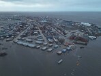 In this aerial photo, the city of Kotzebue, Alaska, experiences flooding. (Alaska Department of Transportation and Public Facilities via AP)