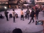Armed Hamas fighters standing behind blindfolded, bound and kneeling men as a crowd surrounds them in a street in Gaza City. Armed Hamas fighters standing behind blindfolded, bound and kneeling men as a crowd surrounds them in a street in Gaza City.