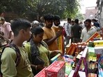 People purchase firecrackers ahead of Diwali near Jama Masjid on Wednesday. (Arvind Yadav/HT)