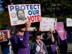 Demonstrators outside the US Supreme Court in Washington, DC on Wednesday, October 15,(Bloomberg)