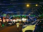 The Sector 22 market illuminated with colourful lights to welcome shoppers during the festive season. (Keshav Singh/HT) The Sector 22 market illuminated with colourful lights to welcome shoppers during the festive season. (Keshav Singh/HT)