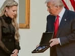 US President Donald Trump presents the Medal of Freedom to Erika Kirk, wife of slain conservative commentator Charlie Kirk.