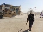 Afghan Taliban fighters patrol near the Afghanistan-Pakistan border in Spin Boldak, Kandahar Province on Wednesday

