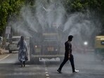 Anti-smog guns being used to spray water droplets to curb air pollution in New Delhi. Anti-smog guns being used to spray water droplets to curb air pollution in New Delhi.