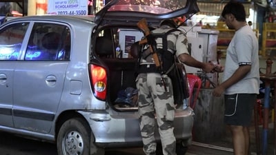 CISF jawans checking two and four wheelers vehicles ahead of Bihar Assembly Election 2025 at Dak Bungalow crossing in Patna.
