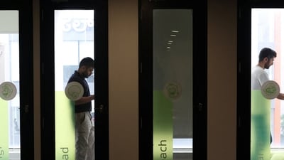 Developers attend a meeting inside pods at the office of AI startup LimeChat in Bengaluru. (REUTERS)