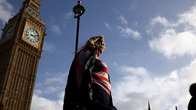 UK Heatwave: People walk in front of the Elizabeth Tower, more commonly known as Big Ben in London, Britain. (Reuters)