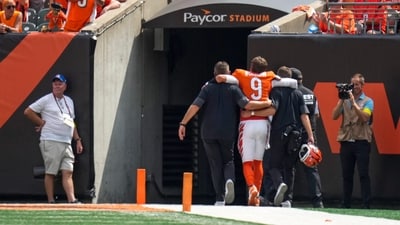 Cincinnati Bengals quarterback Joe Burrow (9) is assisted to the locker room with an injury in the second quarter at Paycor Stadium. (IMAGN IMAGES via Reuters Connect)