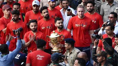 File picture of Royal Challengers Bengaluru's Virat Kohli carrying the IPL trophy at the M. Chinnaswamy Stadium in Bengaluru on June 4. (AFP) File picture of Royal Challengers Bengaluru's Virat Kohli carrying the IPL trophy at the M. Chinnaswamy Stadium in Bengaluru on June 4. (AFP)