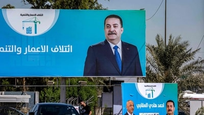 Election billboards for candidates and blocs competing in Iraq's upcoming November parliamentary election, including incumbent Prime Minister Mohammed Shia al-Sudani. (AFP)