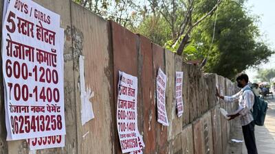 One afternoon, a young man is seen stamping a roadside wall with such flyers near the New Delhi railway station. (HT) One afternoon, a young man is seen stamping a roadside wall with such flyers near the New Delhi railway station. (HT)