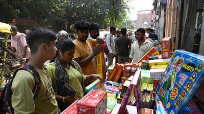 People purchase firecrackers ahead of Diwali near Jama Masjid on Wednesday. (Arvind Yadav/HT)