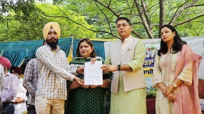 Punjab cabinet minister and AAP state president Aman Arora giving a compensation letter to a flood-affected family. (HT Photo) Punjab cabinet minister and AAP state president Aman Arora giving a compensation letter to a flood-affected family. (HT Photo)