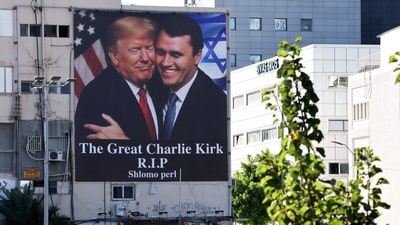 A billboard showing an image of US President Donald Trump (L) embracing US prominent right-wing activist Charlie Kirk. (AFP) A billboard showing an image of US President Donald Trump (L) embracing US prominent right-wing activist Charlie Kirk. (AFP)