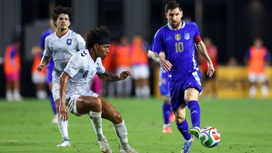 Lionel Messi controls the ball against Isaac Angking of Puerto Rico during the International Friendly match between Puerto Rico and Argentina (Getty Images via AFP)