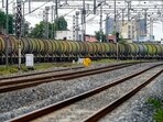 A man sits by railway tracks as a freight train transports petrol wagons (AFP FILE/REPRESENTATIVE IMAGE) A man sits by railway tracks as a freight train transports petrol wagons (AFP FILE/REPRESENTATIVE IMAGE)