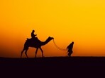 Enjoy starlit nights, camel rides, and vibrant sunsets while camping in Jaisalmer’s desert.(Unsplash)