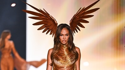 Joan Smalls looked stunning in a gold fringe mini dress featuring a halter neckline and a playful short hemline. (Evan Agostini/Invision/AP)