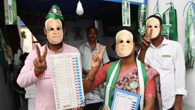 JDU supporters wearing Nitish's masks holding dummy of Electronic Voting Machines (EVMs) ahead of Bihar Assembly Election 2025.