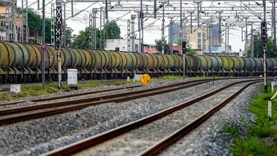 A man sits by railway tracks as a freight train transports petrol wagons (AFP FILE/REPRESENTATIVE IMAGE) A man sits by railway tracks as a freight train transports petrol wagons (AFP FILE/REPRESENTATIVE IMAGE)