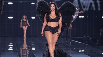 US model Ashley Graham rocked a black bralette with shimmer detailing and a high-waisted matching netted bottom, complete with furry black wings attached. (AFP)