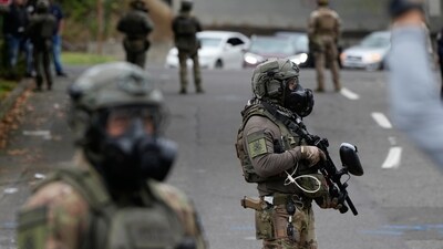 The NYT Chicago bureau chief said federal agents are asking people about their legal status outside churches, homeless shelters, apartment buildings, parks and even a cemetery. (AP) The NYT Chicago bureau chief said federal agents are asking people about their legal status outside churches, homeless shelters, apartment buildings, parks and even a cemetery. (AP)