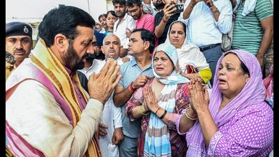 Haryana chief minister Nayab Singh Saini meets the family of the deceased ASI Sandeep in Rohtak on Wednesday. (ANI) Haryana chief minister Nayab Singh Saini meets the family of the deceased ASI Sandeep in Rohtak on Wednesday. (ANI)