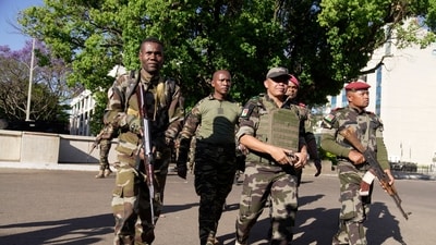 CAPSAT military unit commander Col. Michael Randrianirina, center, arrives at the Presidency to announce that the armed forces are taking control of the country in Antananarivo, Madagascar, Tuesday, Oct. 14, 2025. (AP Photo/ Brian Inganga) (AP) CAPSAT military unit commander Col. Michael Randrianirina, center, arrives at the Presidency to announce that the armed forces are taking control of the country in Antananarivo, Madagascar, Tuesday, Oct. 14, 2025. (AP Photo/ Brian Inganga) (AP)